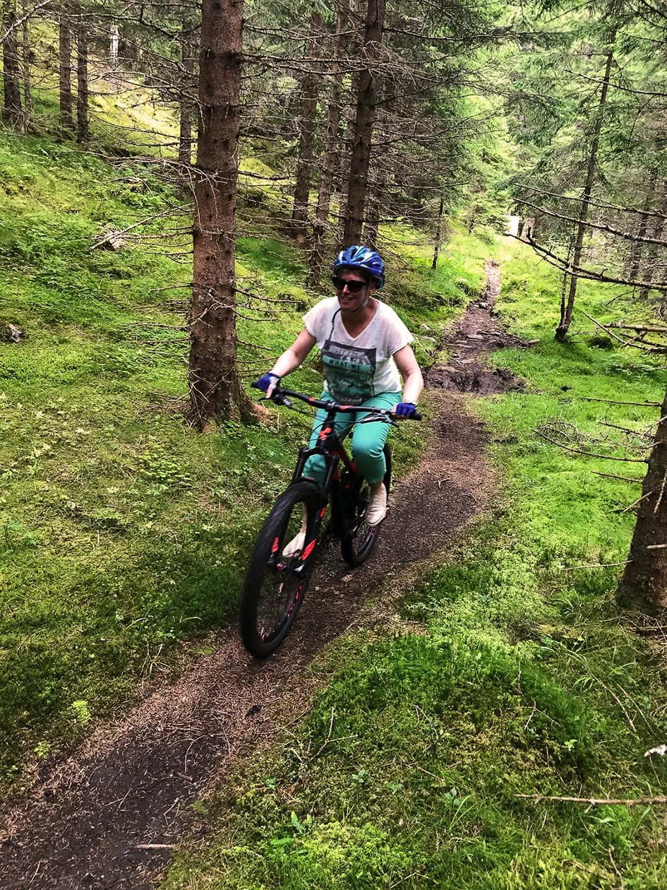 Cyclist riding forest road